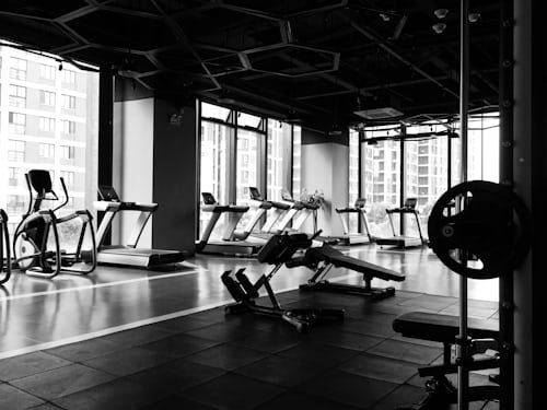 Personal Trainer Helping Client